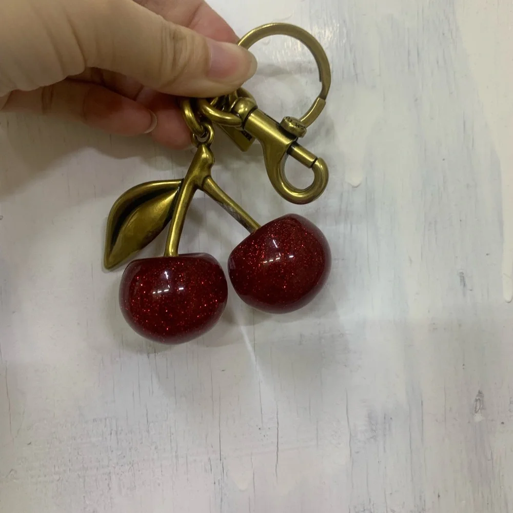 Coach Gold-Tone Glitter Cherry Key Charm in Red